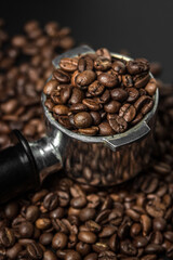 Coffee beans in a portafilter. Preparing coffee in a coffee machine