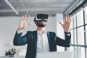A Businessman using virtual reality VR headset for work in the office. A man wearing VR glasses at co working space. Concept of innovation, lifestyle, Metaverse, entertainment, digital, AR, futuristic