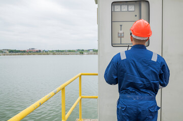 Water plant maintenance technicians, mechanical engineers check the control system at the water treatment plant.
