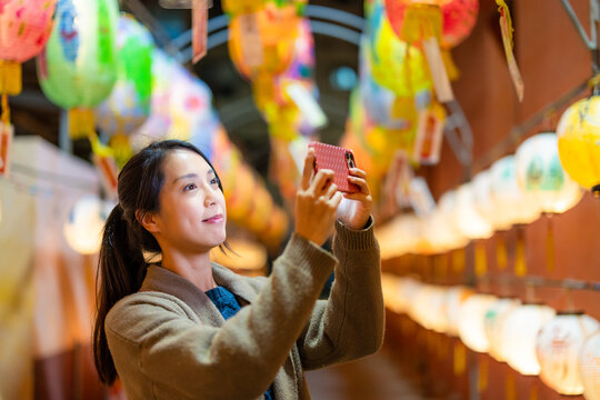 Woman take photo of the lantern at outdoor