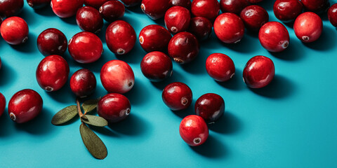 healthy and tasty cranberries, close up, isolated on blue background, created with generative ai
