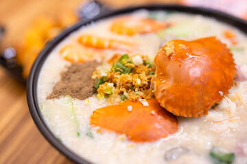 Seafood crab congee rice bowl in restaurant © leungchopan