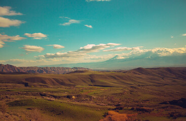 Toned beautiful Landscape in spring season in Armenia. Mountains, large valley. Sunny day outdoor. Nature in the hills	