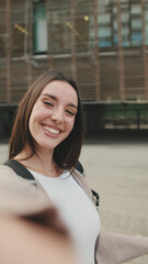 Close-up of a young woman taking a selfie on a mobile phone