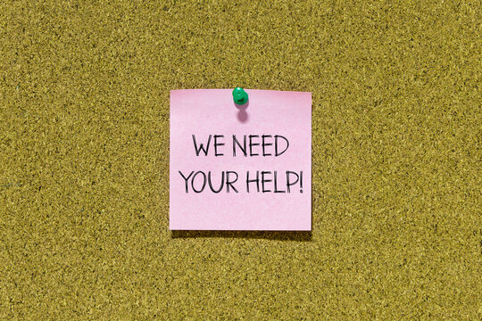 We need your help text on pink post-it paper pinned on bulletin cork board. This message can be used in business concept about needing your help.