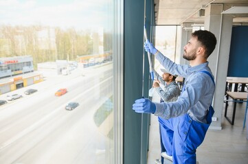 A man cleaning windows. cleaning team of men washes the windows