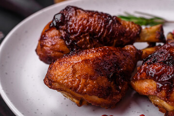Delicious grilled chicken legs with spices and herbs in teriyaki sauce