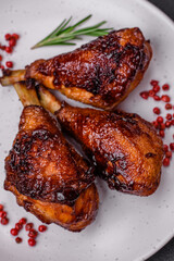 Delicious grilled chicken legs with spices and herbs in teriyaki sauce