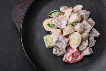Delicious salad with boiled beef tongue, quail eggs, tomatoes and cucumber