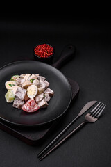 Delicious salad with boiled beef tongue, quail eggs, tomatoes and cucumber