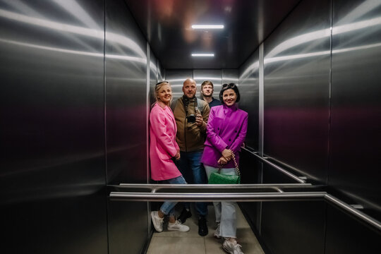 Four travelers in the elevator