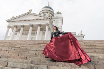 Helsinki. Finland. 25.04.2023 .A sexy woman with a perfect figure stands on Helsinki's Central...