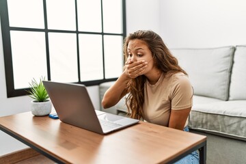 Young beautiful hispanic woman having video call communicate with sign deaf language at home