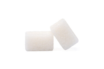 White sugar cubes on the white background