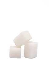 White sugar cubes on the white background