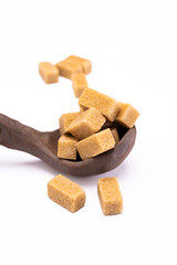 Brown sugar and spoon isolated on white background