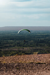 Paragliding above landscape of rural scene. Extreme sport concept