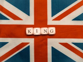 The inscription king on british union jack flag close up,coronation concept