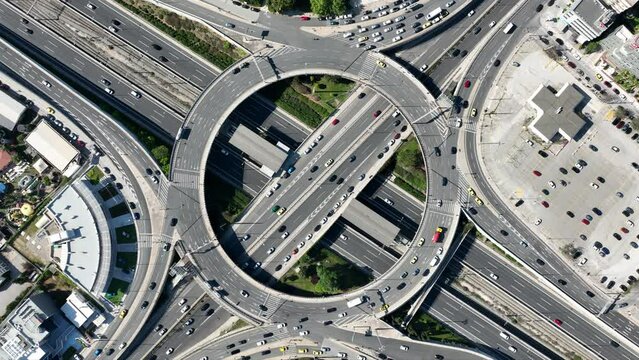 Aerial drone time lapse video of ring road junction passing through Marousi residential area connecting Attiki odos highway and Kifisias Avenue, Attica, Greece