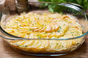bowl of sliced baked potato gratin