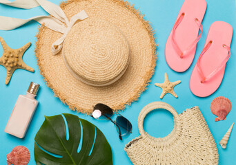 Beach accessories on color background, flat lay