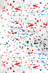 Multicolored splashes of gouache paint drops	
