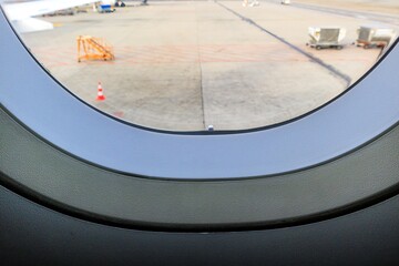 pressure equalization hole in an airplane window