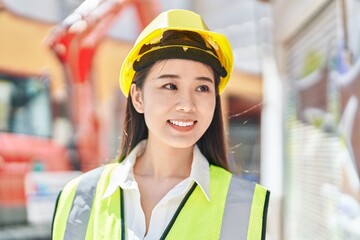 Young chinese woman architect smiling confident standing at street