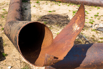 Damaged rusty large diameter water pipe