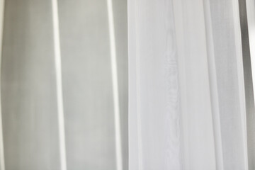 Voile curtain in front of window with space for copy