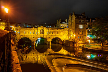 Pulteney Bridge over River Avon, at night. Bath, England, United Kingdom. Palladian style.