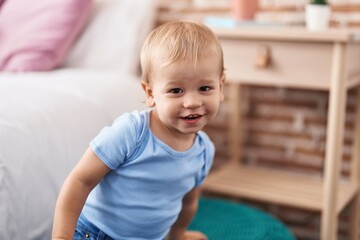 Adorable toddler smiling confident standing at bedroom