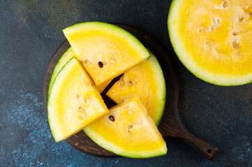 Cut yellow watermelon on table. Fresh summer food. Healthy nutrition