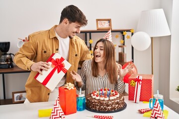 Mand and woman couple having birthday celebration at home