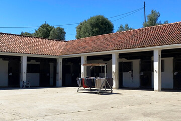 Horse blankets drying in the sun in the stable, Lisbon, Portugal