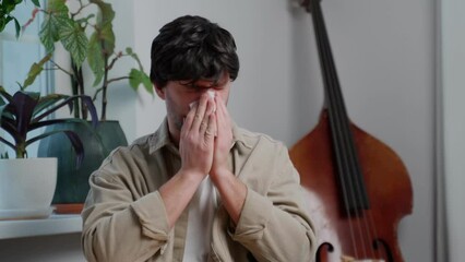 The man caught a cold, he has the flu, a runny nose. Healthcare and medical concept