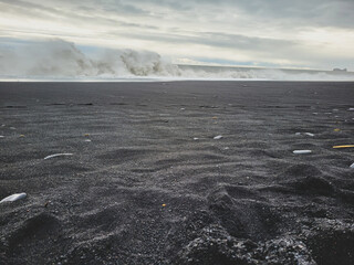 black beach with stormy sea in iceland