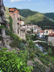 canyon next to italian village in summer