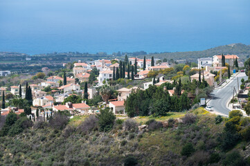 Fototapeta na wymiar Tala, Cyprus - Green rocky mountains and white houses of the village