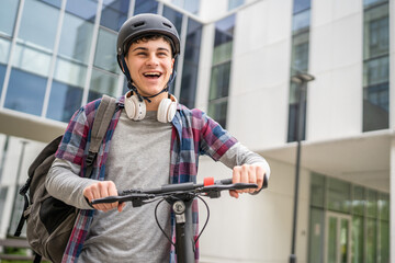 Young man caucasian teenager with electric kick push scooter in city © Miljan Živković
