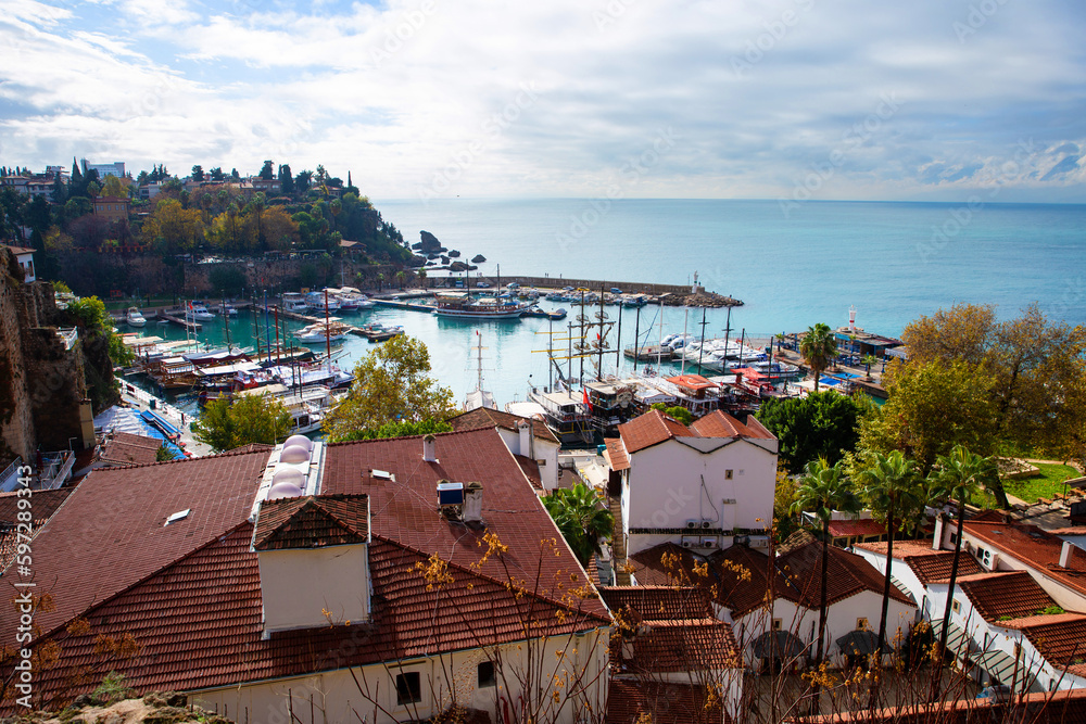 Wall mural The old port of Antalya - Antalya Kaleici Yat Limani. The old town. With yachts, boats. and old buildings. View from above. Antalya, Turkiye.