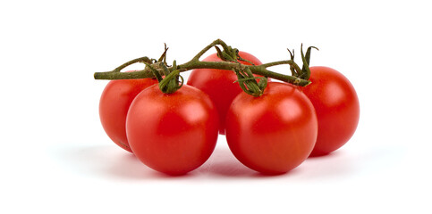 Tomato cherry on branch isolated on white background.
