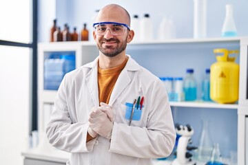 Young man scientist standing at laboratory