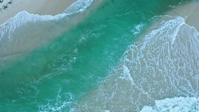 Aerial Drone View of famous beach town Trancoso in Bahia Brazil flying over river and ocean with tides and waves