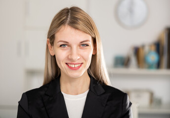 Woman manager expresses various positive emotions in a modern office