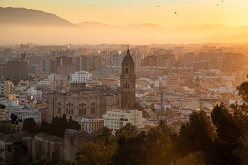 Fototapeta premium view over Malaga at sunset travel banner