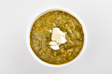 Top view of sarso ka saag with makhan isolated on white background - obrazy, fototapety, plakaty