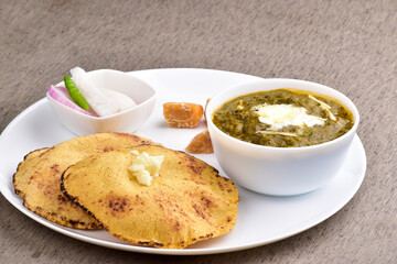 Sarso saag with makki roti in plate, healthy punjabi food