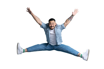 Overjoyed asian man with stylish  jumping in twine, having fun, celebration success isolated on...