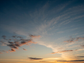 Stunning sun rise sky with clouds. Warm and cool color. Background for design and sky replacement.